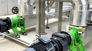 Two Kronoa Engineered Solutions progressive cavity pumps installed at a wastewater treatment plant (WWTP) for efficient sludge handling.